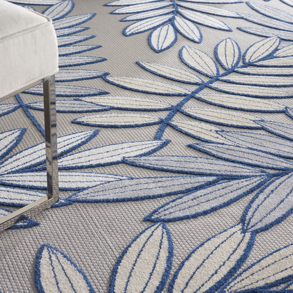 7' x 10' Ivory and Navy Leaves Indoor Outdoor Area Rug