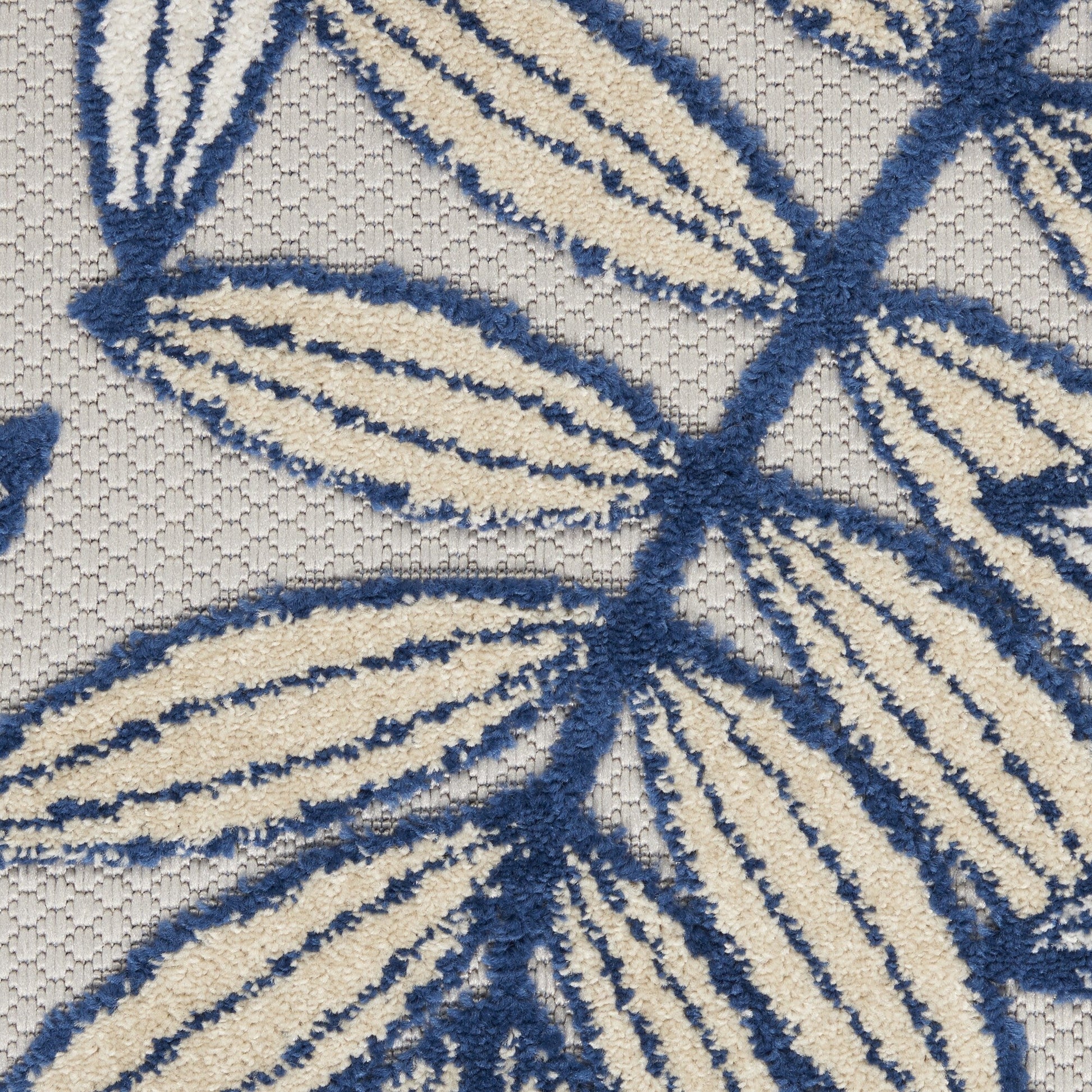 7' x 10' Ivory and Navy Leaves Indoor Outdoor Area Rug