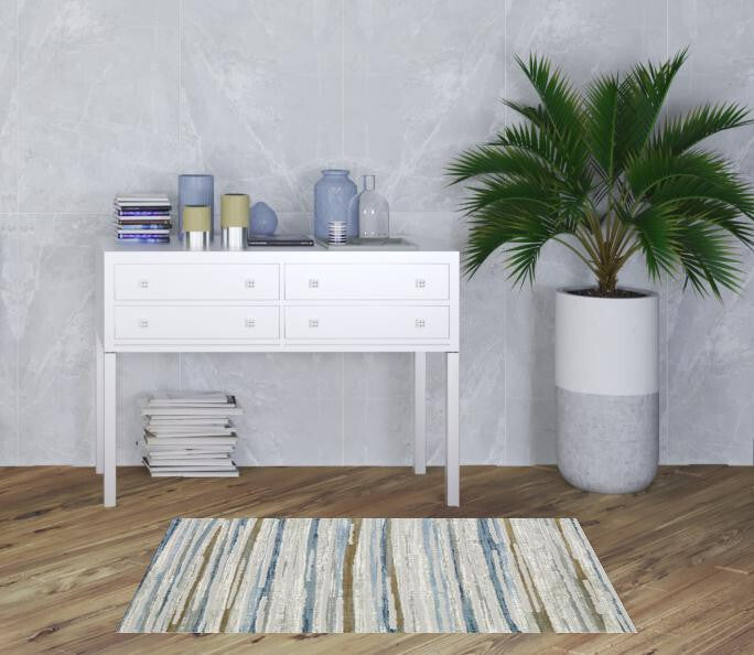 3' X 5' Grey Blue Ivory Brown Beige And Navy Abstract Power Loom Stain Resistant Area Rug