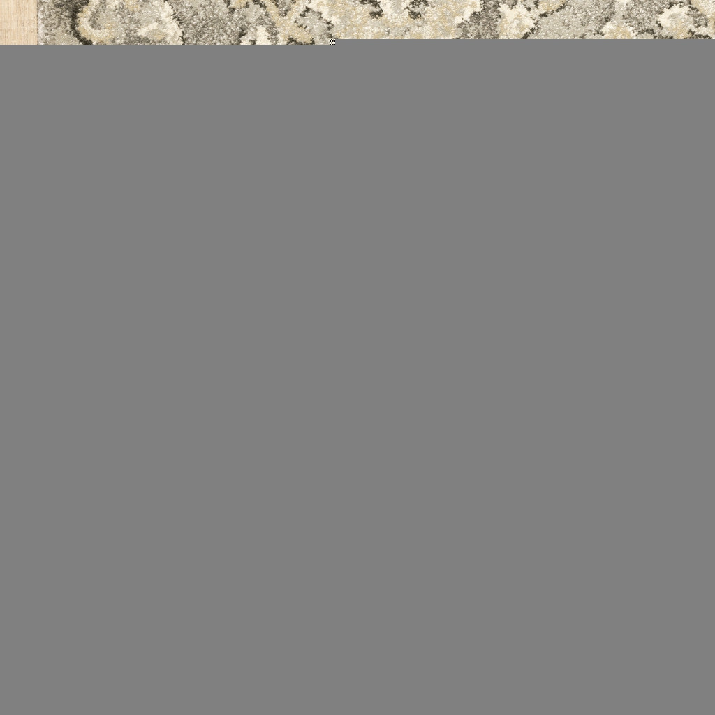 5' X 8' Grey Beige Tan And Brown Oriental Power Loom Stain Resistant Area Rug