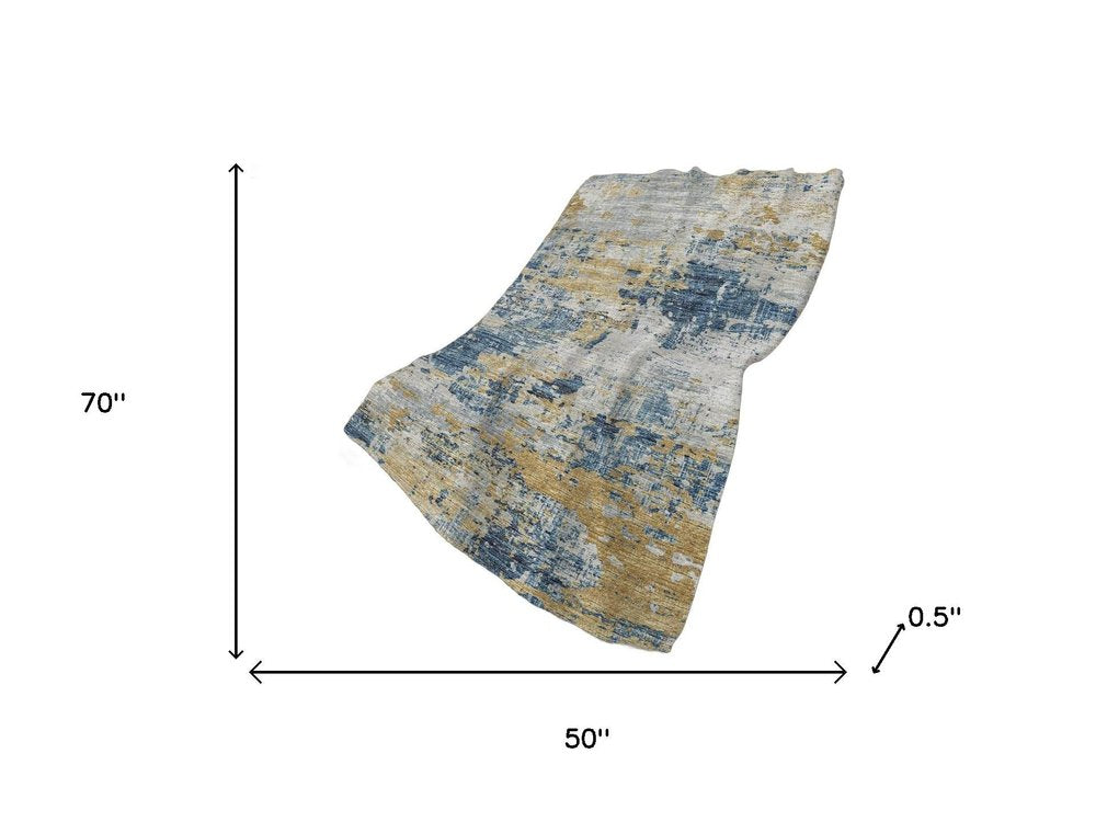 50" X 70" Blue Gold And Ivory Abstract Polyester Woven Plush Throw Blanket