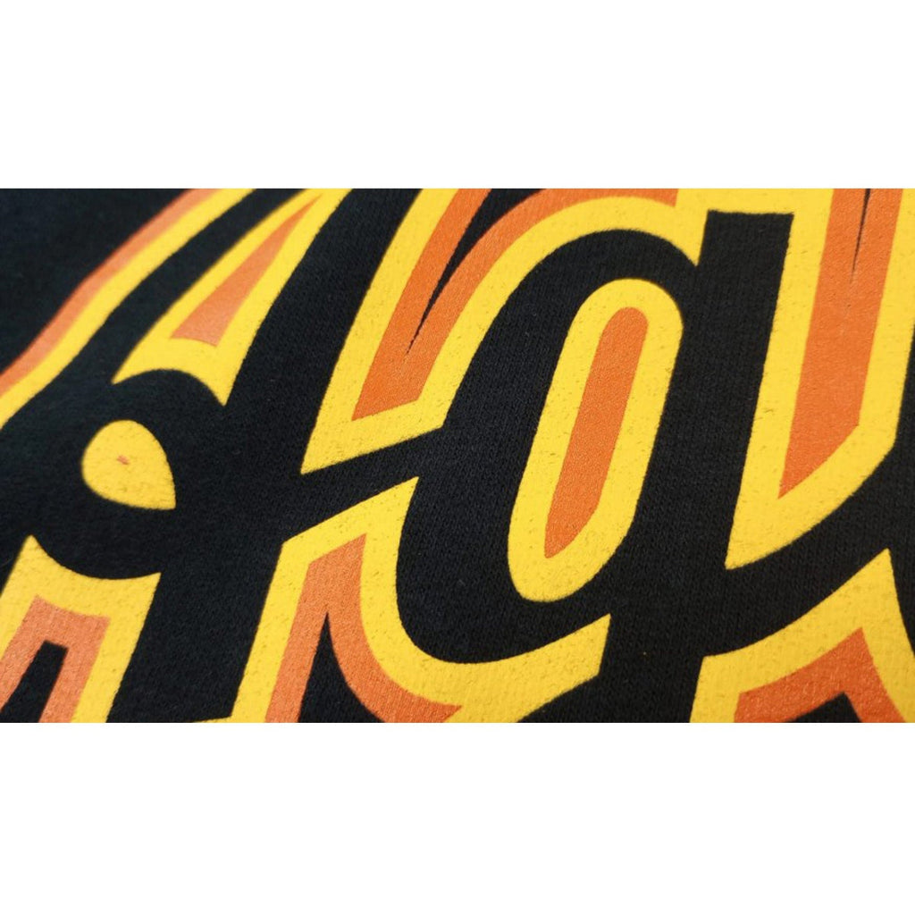 Aguilas Cibaeñas Cursive letters and Black Hooded