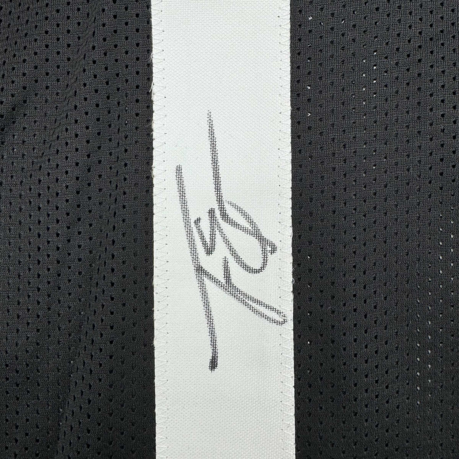 Framed Autographed/Signed Travis Etienne Jr. 35x39 Jacksonville Black Football Jersey Beckett BAS COA