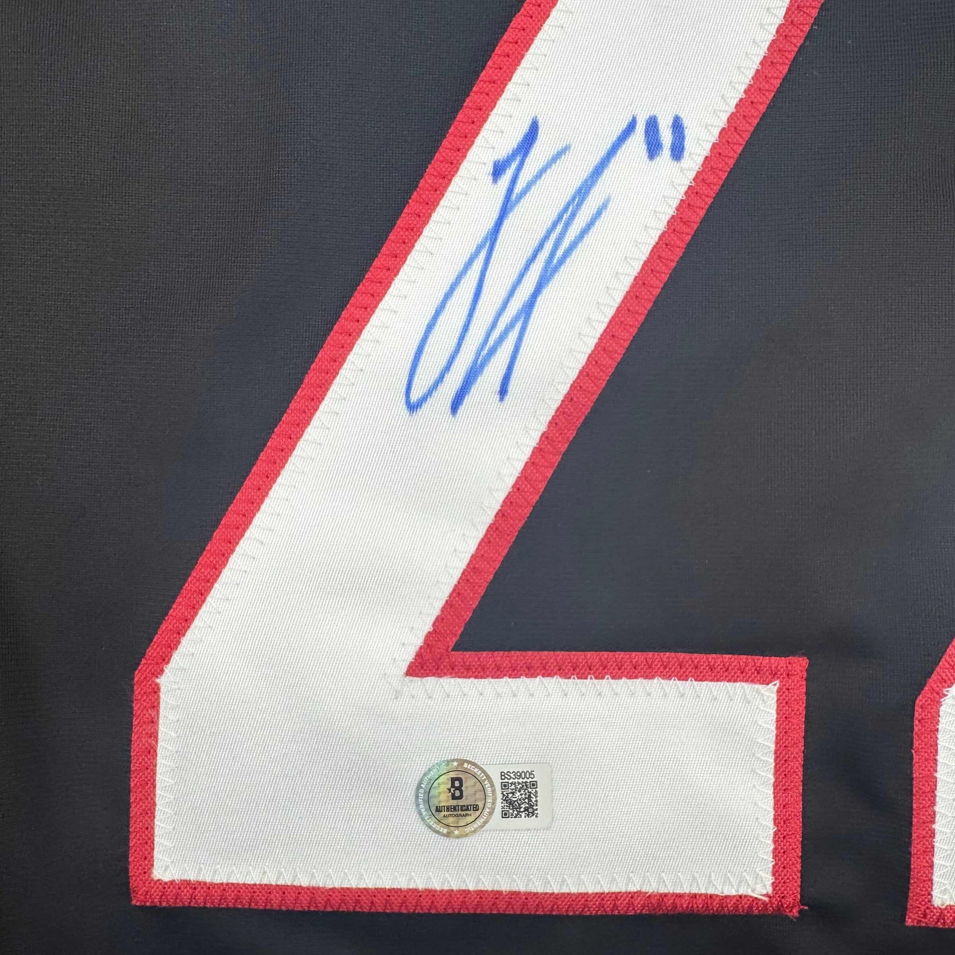 Autographed/Signed Logan Stankoven Carolina Black Hockey Jersey Beckett BAS COA