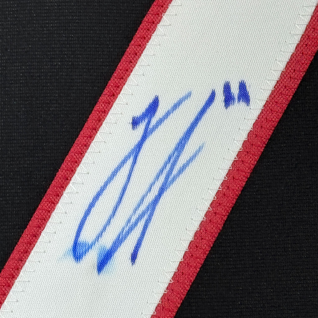 Framed Autographed/Signed Logan Stankoven 35x39 Carolina Black Hockey Jersey Beckett BAS COA