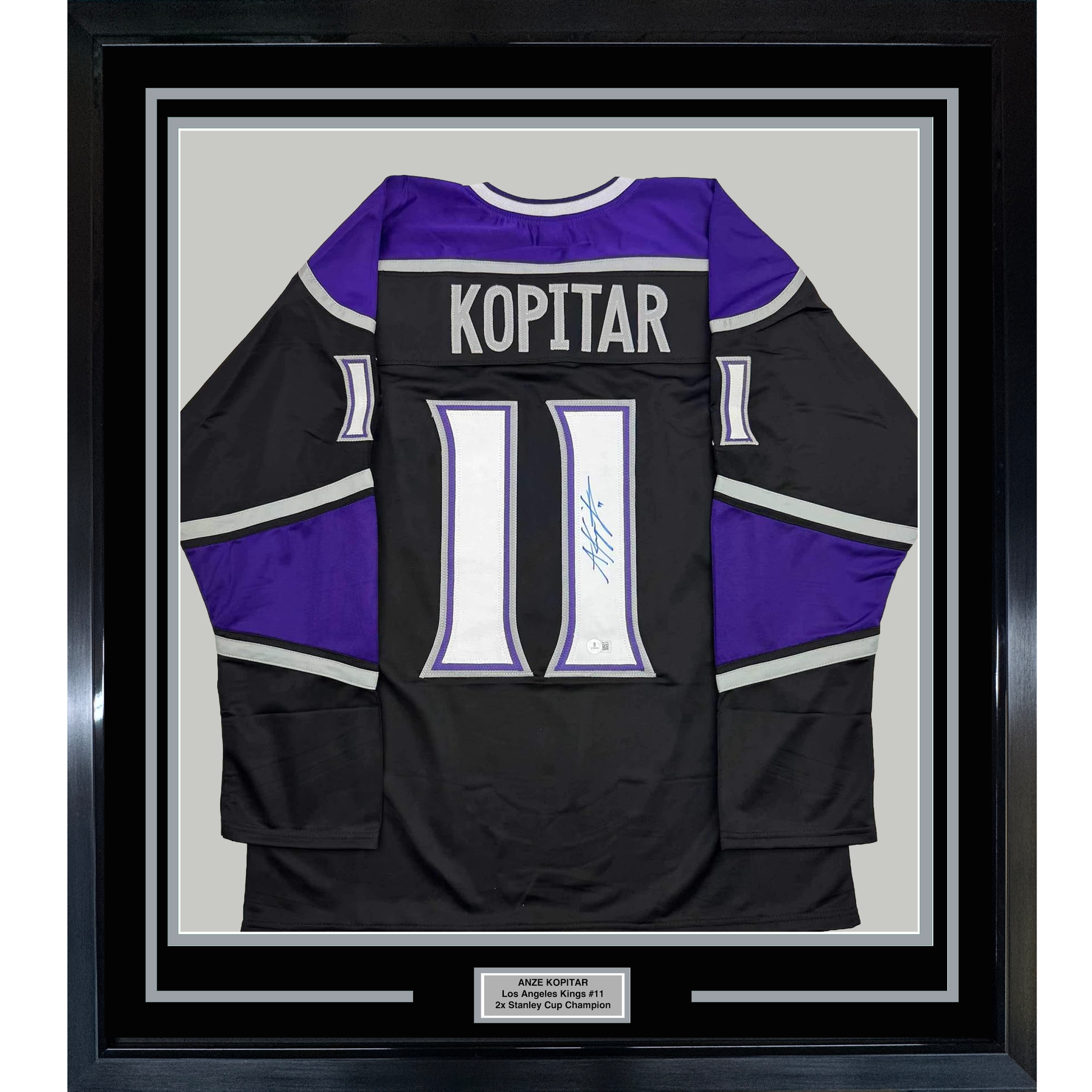 Framed Autographed/Signed Anze Kopitar 35x39 Los Angeles LA Black Hockey Jersey Beckett BAS COA #2